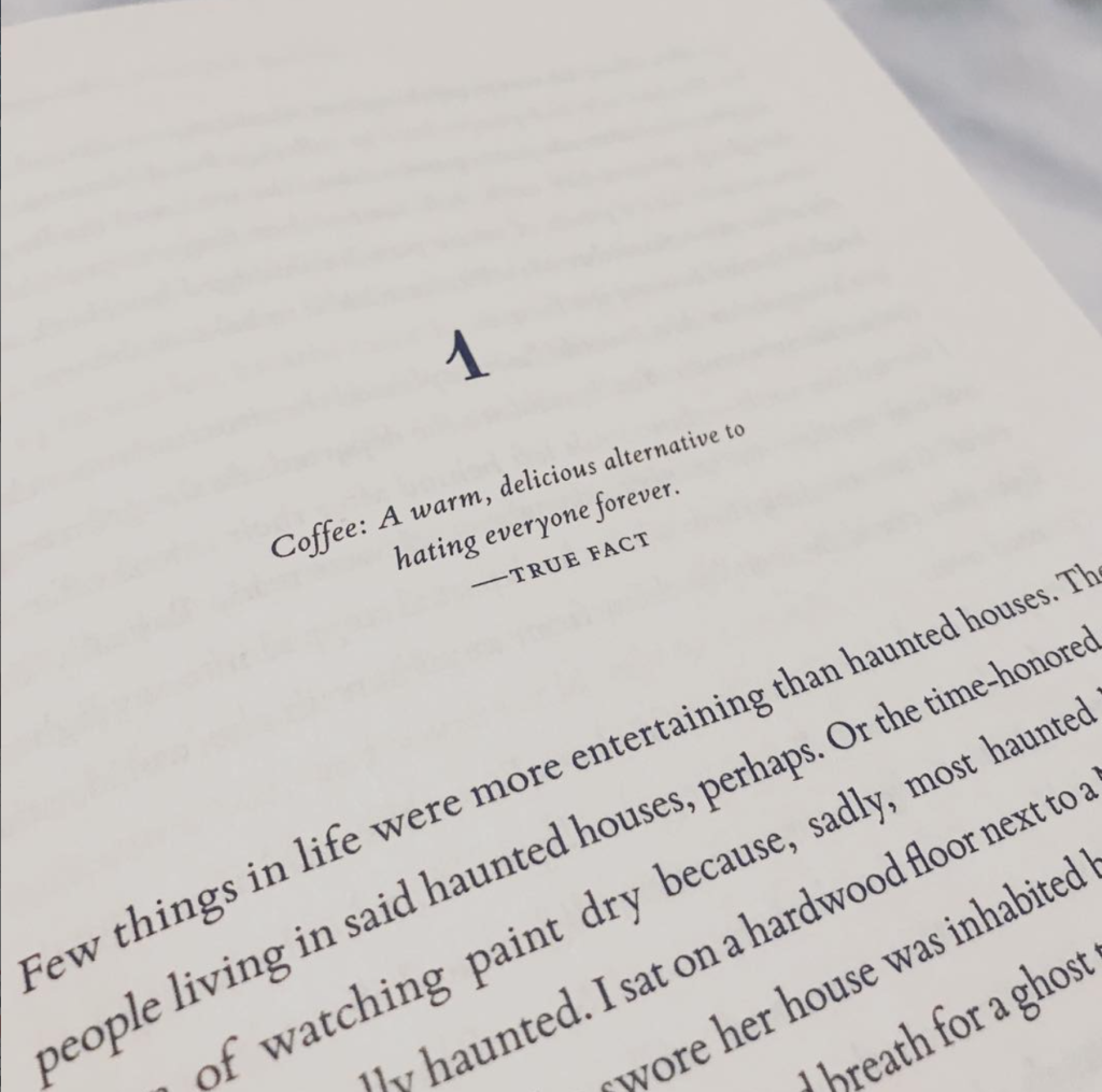 The writing of words on a page within a book