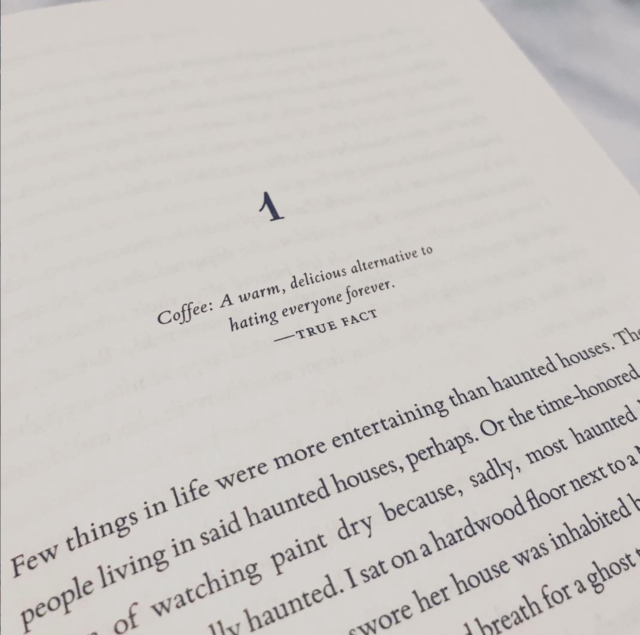 The writing of words on a page within a book
